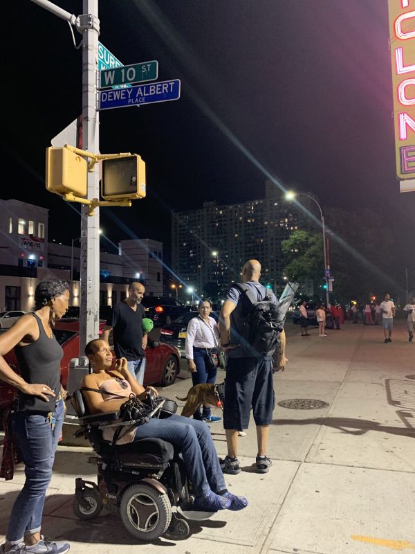 A group of people enjoying a summer night in NYC